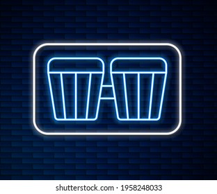 Glowing neon line Drum icon isolated on brick wall background. Music sign. Musical instrument symbol.  Vector
