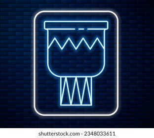 Glowing neon line Drum icon isolated on brick wall background. Music sign. Musical instrument symbol.  Vector
