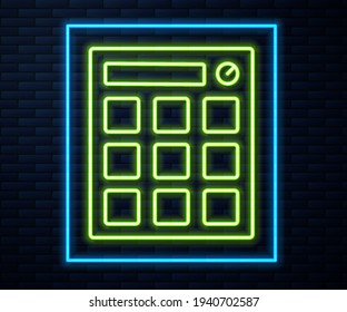 Glowing neon line Drum machine music producer equipment icon isolated on brick wall background.  Vector