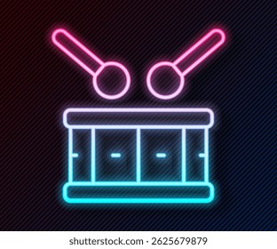 Glowing neon line Drum with drum sticks icon isolated on black background. Music sign. Musical instrument symbol.  Vector