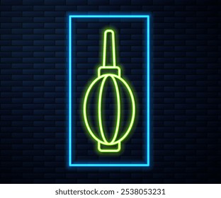 Glowing neon line Dust blower icon isolated on brick wall background. Air duster. Lens cleaner. Camera sensor cleaning.  Vector