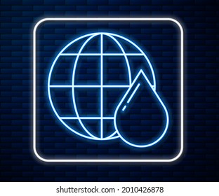 Glowing neon line Earth planet in water drop icon isolated on brick wall background. Saving water and world environmental protection.  Vector Illustration