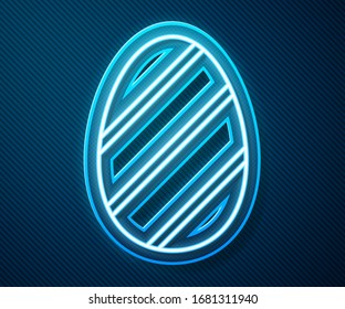 Glowing neon line Easter egg icon isolated on blue background. Happy Easter.  Vector Illustration