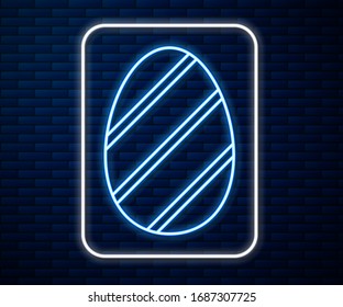Glowing neon line Easter egg icon isolated on brick wall background. Happy Easter.  Vector Illustration