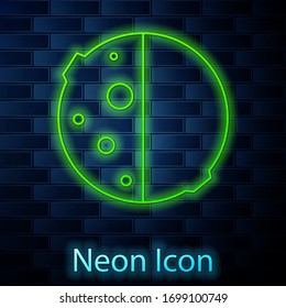 Glowing neon line Eclipse of the sun icon isolated on brick wall background. Total sonar eclipse. Vector Illustration