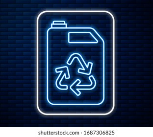 Glowing neon line Eco fuel canister icon isolated on brick wall background. Eco bio and barrel. Green environment and recycle.  Vector Illustration