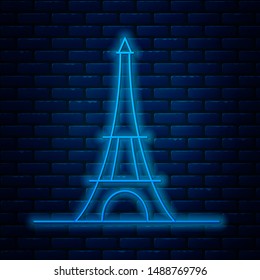 Glowing neon line Eiffel tower icon isolated on brick wall background. France Paris landmark symbol.  Vector Illustration