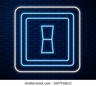 Glowing neon line Electric light switch icon isolated on brick wall background. On and Off icon. Dimmer light switch sign. Concept of energy saving.  Vector Illustration