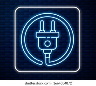 Glowing neon line Electric plug icon isolated on brick wall background. Concept of connection and disconnection of the electricity.  Vector Illustration