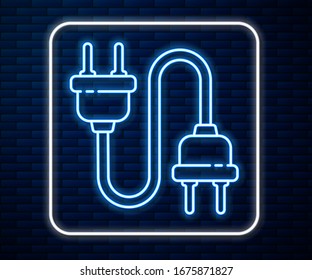 Glowing neon line Electric plug icon isolated on brick wall background. Concept of connection and disconnection of the electricity.  Vector Illustration