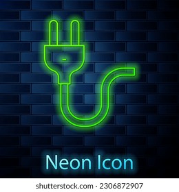 Glowing neon line Electric plug icon isolated on brick wall background. Concept of connection and disconnection of the electricity.  Vector
