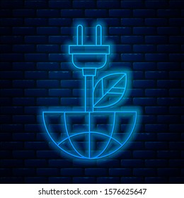 Glowing neon line Electric saving plug in leaf icon isolated on brick wall background. Save energy electricity icon. Environmental protection icon. Bio energy.  Vector Illustration
