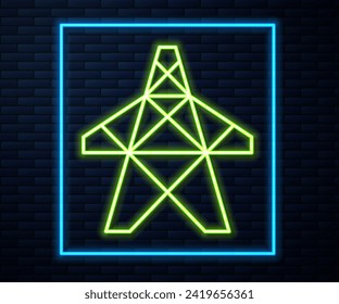 Glowing neon line Electric tower used to support an overhead power line icon isolated on brick wall background. High voltage power pole line.  Vector