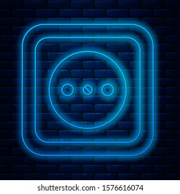 Glowing neon line Electrical outlet icon isolated on brick wall background. Power socket. Rosette symbol.  Vector Illustration