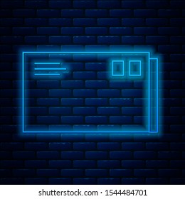 Glowing neon line Envelope icon isolated on brick wall background. Email message letter symbol.  Vector Illustration