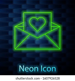 Glowing neon line Envelope with Valentine heart icon isolated on brick wall background. Message love. Letter love and romance.  Vector Illustration