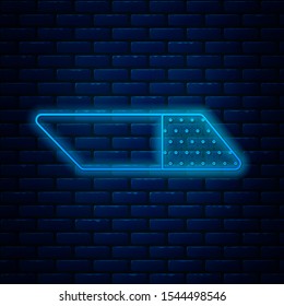 Glowing neon line Eraser or rubber icon isolated on brick wall background.  Vector Illustration