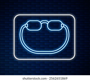 Glowing neon line Eyeglasses icon isolated on brick wall background.  Vector