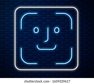 Glowing neon line Face recognition icon isolated on brick wall background. Face identification scanner icon. Facial id. Cyber security concept.  Vector Illustration