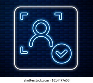 Glowing neon line Face recognition with check mark icon isolated on brick wall background. Face identification scanner icon. Facial id. Cyber security concept.  Vector