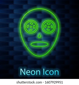 Glowing neon line Facial cosmetic mask icon isolated on brick wall background. Cosmetology, medicine and health care.  Vector Illustration