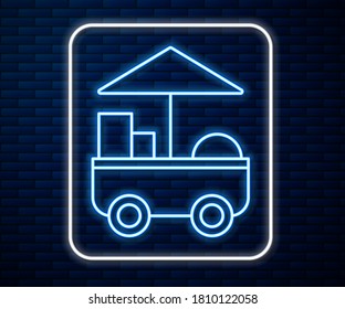 Glowing neon line Fast street food cart icon isolated on brick wall background. Urban kiosk.  Vector Illustration