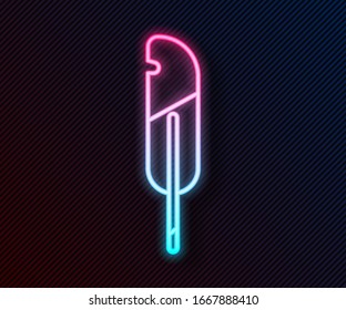 Glowing neon line Feather pen icon isolated on black background.  Vector Illustration