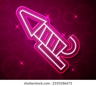 Glowing neon line Firework rocket icon isolated on red background. Concept of fun party. Explosive pyrotechnic symbol.  Vector