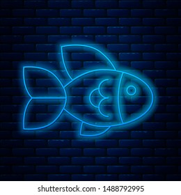 Glowing neon line Fish icon isolated on brick wall background.  Vector Illustration