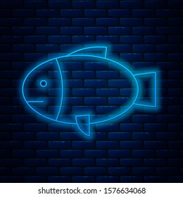Glowing neon line Fish icon isolated on brick wall background.  Vector Illustration