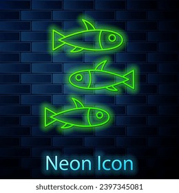 Glowing neon line Fishes icon isolated on brick wall background.  Vector