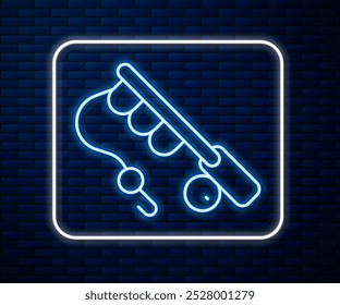 Glowing neon line Fishing rod icon isolated on brick wall background. Fishing equipment and fish farming topics.  Vector