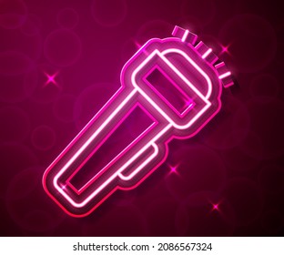 Glowing neon line Flashlight icon isolated on red background.  Vector