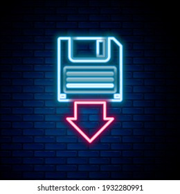 Línea de neón brillante Icono de copia de seguridad de disquetes aislado en el fondo de pared de ladrillo. Señal de disquete. Concepto de esquema colorido. Vector