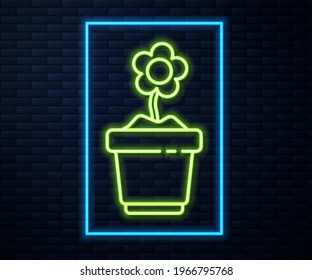 Glowing neon line Flower in pot icon isolated on brick wall background. Plant growing in a pot. Potted plant sign.  Vector Illustration