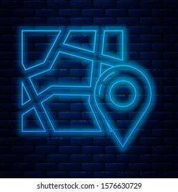 Glowing neon line Folded map with location marker icon isolated on brick wall background.  Vector Illustration