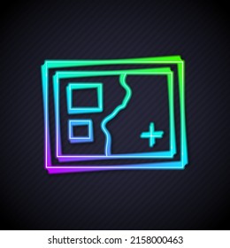 Glowing neon line Folded map icon isolated on black background.  Vector