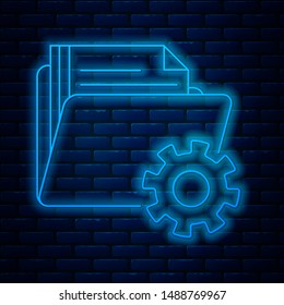Glowing neon line Folder settings with gears icon isolated on brick wall background. Software update, transfer protocol, teamwork tool management.  Vector Illustration