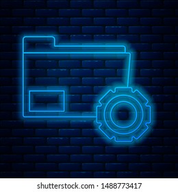 Glowing neon line Folder settings with gears icon isolated on brick wall background. Software update, transfer protocol, teamwork tool management, copy process.  Vector Illustration
