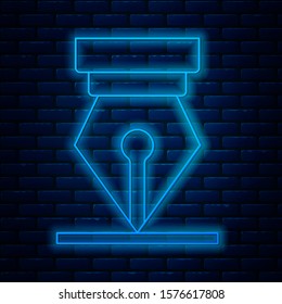 Glowing neon line Fountain pen nib icon isolated on brick wall background. Pen tool sign.  Vector Illustration