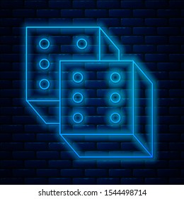 Glowing neon line Game dice icon isolated on brick wall background. Casino gambling.  Vector Illustration