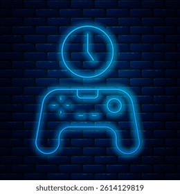 Glowing neon line Gamepad of time icon isolated on brick wall background. Time to play games. Game controller.  Vector