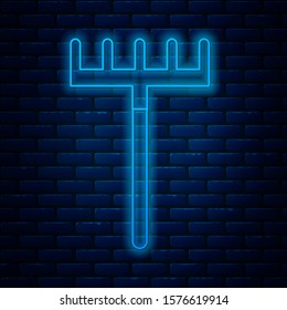 Glowing neon line Garden rake icon isolated on brick wall background. Tool for horticulture, agriculture, farming. Ground cultivator. Housekeeping equipment.  Vector Illustration