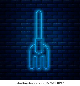 Glowing neon line Garden rake icon isolated on brick wall background. Tool for horticulture, agriculture, farming. Ground cultivator. Housekeeping equipment.  Vector Illustration