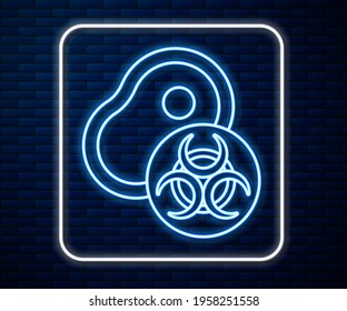 Glowing neon line Genetically modified meat icon isolated on brick wall background. Syringe being injected to meat.  Vector
