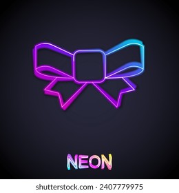 Glowing neon line Gift bow icon isolated on black background.  Vector