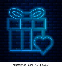 Glowing neon line Gift box and heart icon isolated on brick wall background. Valentines day.  Vector Illustration