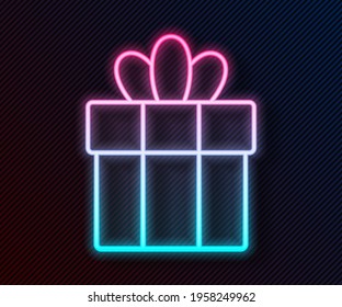 Glowing neon line Gift box icon isolated on black background. Merry Christmas and Happy New Year.  Vector