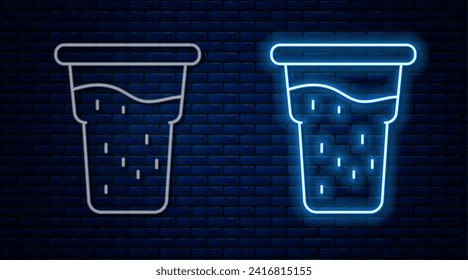 Glowing neon line Glass of beer icon isolated on brick wall background.  Vector