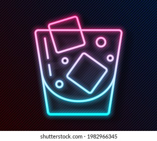 Glowing neon line Glass of whiskey and ice cubes icon isolated on black background.  Vector